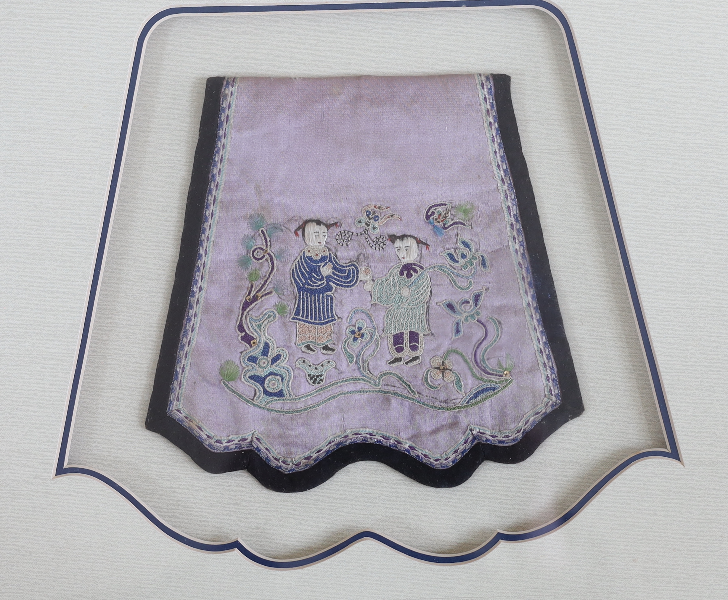 A late 19th century Chinese purple silk purse, embroidered with a sage, fish, butterflies and flowers, another silk purse embroidered in silver metal thread and polychromes silk threads, together with a similar figurativ